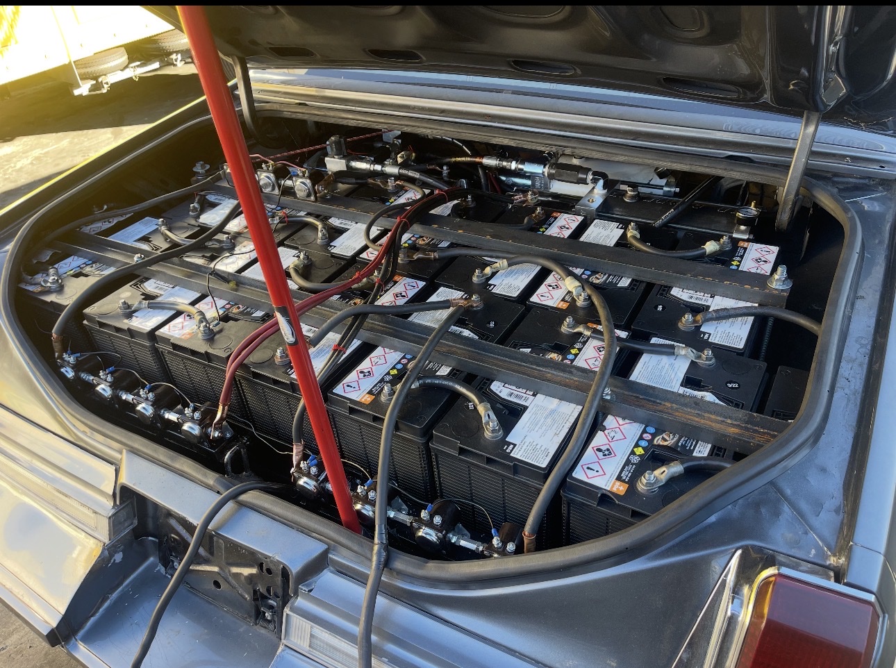 Angled lowrider trunk setup with batteries